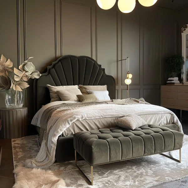 Luxurious bedroom with a large bed, upholstered bench, and decorative elements.