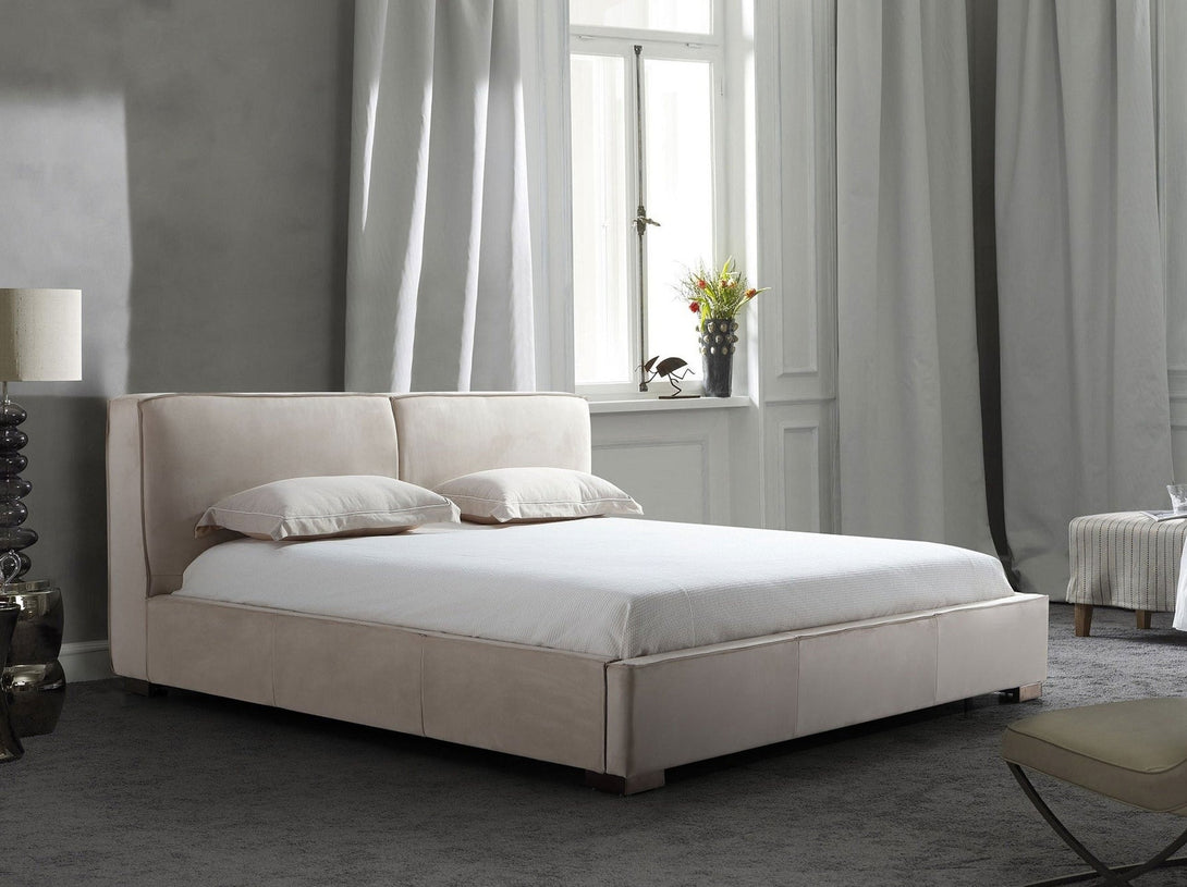 Serene Platform Bed with sleek wooden frame and upholstered headboard for modern bedrooms.