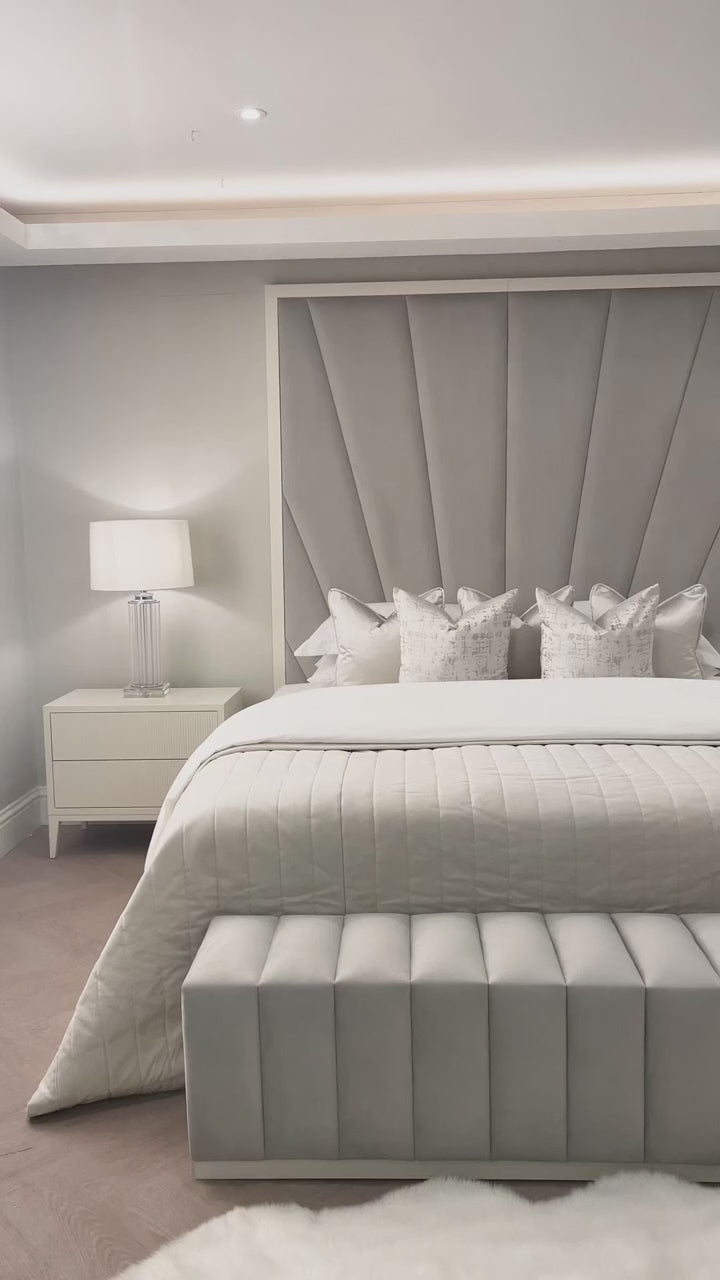 Elegant white and grey bed design for a serene bedroom decor.