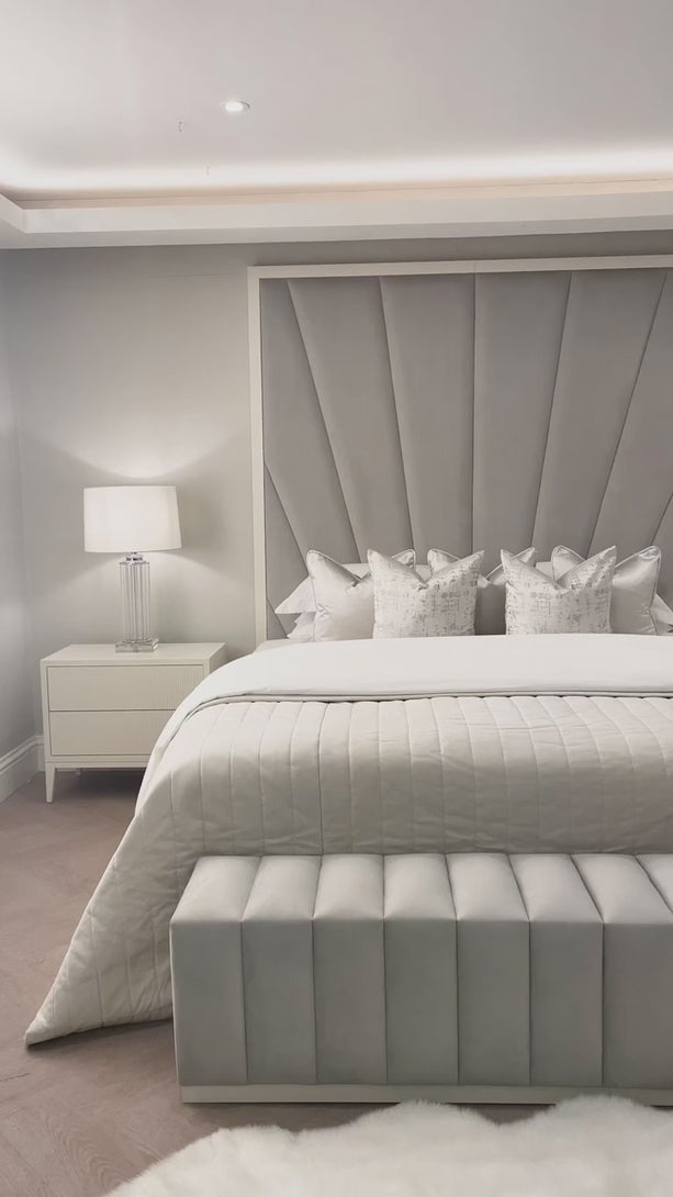 Elegant white and grey bed design for a serene bedroom decor.
